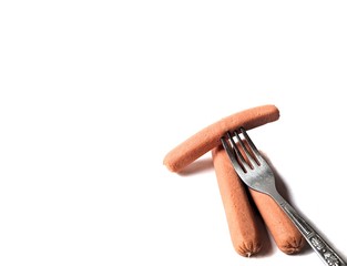 Turkey sausages with fork on white background. healthy food concept