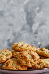 Oatmeal cookies in a plate close-up. Homemade healthy pastries. Vertical image. Free space for text. Healthy Sweet Breakfast