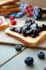 sweet blueberries jam on toast close up
