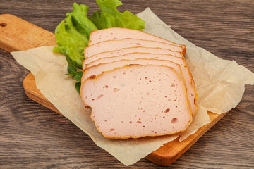 Boiled pork sausage over board