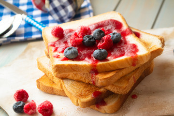 French toast with fresh summer berries and maple syrup