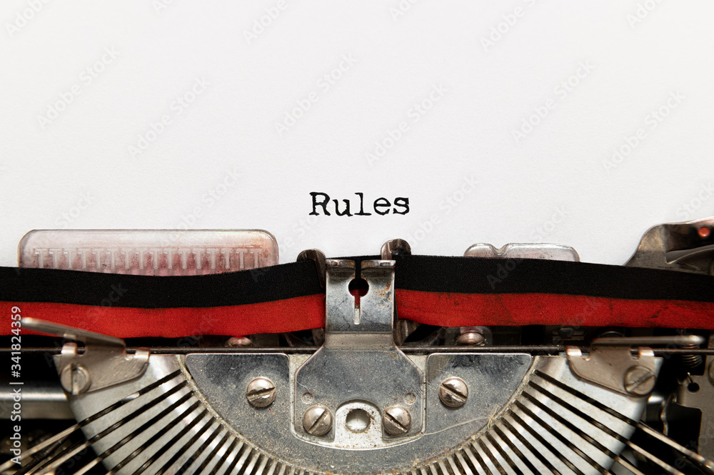 Fototapete rules title text written on paper with typewriter