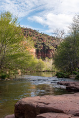 Fototapeta na wymiar Water and red rocks of Oak Creek in Sedona, Arizona