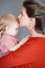 A young mother with her one-year-old little son