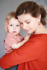 A young mother with her one-year-old little son