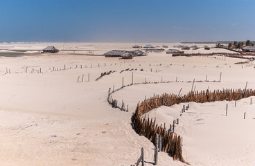 Typical houses on Praia de Cabure in the Lençois Maranhenses National Park, Maranhão, Brazil on October 12, 2006. On the north Atlantic coast of Brazil, known for its natural beauty and desert lands