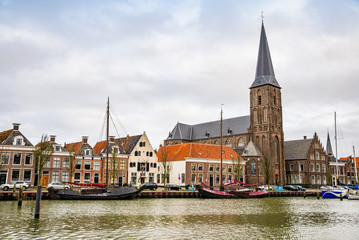 Fototapeta premium January 10, 2020. H. Aartsengel Michael kerk - Church by the water canal in winter