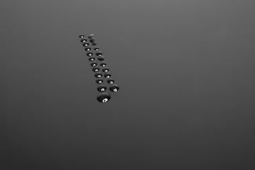 Detail of water drops, Dark color tone, abstract background