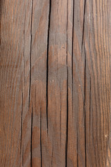 Old wood background in brown colors with deep cracks