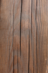 Fototapeta premium Old wood background in brown colors with deep cracks