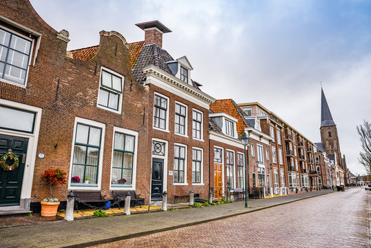 Harlingen, Netherlands - January 10, 2020. Zuiderhaven street in winter with traditional dutch houses