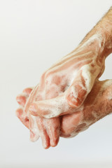 A man washes his hands.On white background.