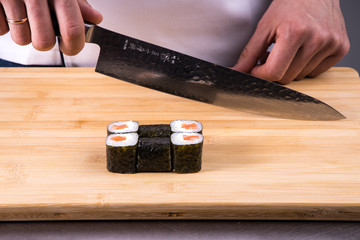 chef cooking rolls in restaurant kitchen