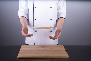 Chef cooking shawarma in restaurant kitchen