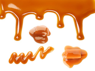 Caramel candies and tasty sauce on white background