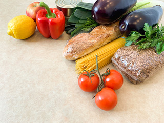 Crisis food products for isolation period. Macaroni, oil, canned food, vegetables, sugar, oatmeal, millet, lemons, ginger. Food Delivery, Donation, Coronavirus Quarantine.