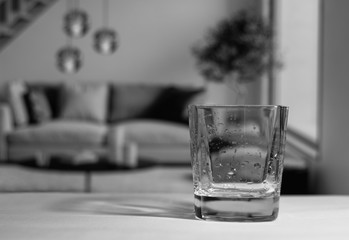 glass on the table in living room and plant