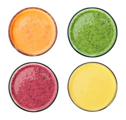 Set of different fresh tasty smoothies on white background, top view
