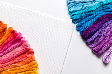 background of multicolored embroidery threads