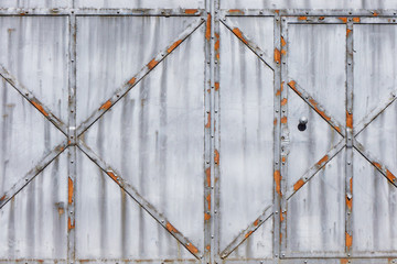 Metal door texture. Grunge iron gate background. Rusty entrance doorway.  Safety heavy lock no access architecture pattern. Steel vintage style home protection.