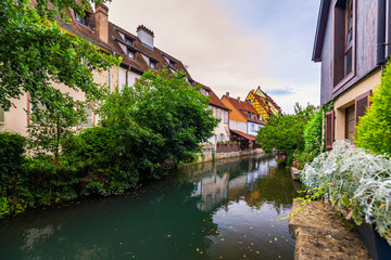 Fototapeta na wymiar Colmar, Alsace, France. Petite Venice, water canal and traditional half timbered houses. Colmar is a charming town in Alsace, France. Beautiful view of colorful romantic city Colmar, France, Alsace.