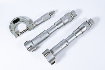 Micrometer on a white background. Modern measuring device.