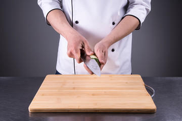 chef cuts cucumber in the restaurant kitchen7