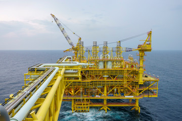 Oil and gas industry at offshore. Daylight scene at oil and gas platform complex at process area with pipelines and valves.    