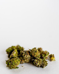 Marijuana nugs against a white background