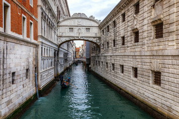 Fototapeta na wymiar Canal with gondolas in Venice, Italy. Architecture and landmarks of Venice. Venice postcard with Venice gondolas.
