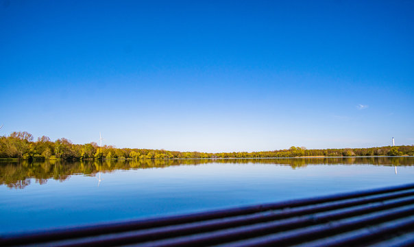 Beautiful, blue and deserted Unisee - a lake in Bremen at sun and blue sky