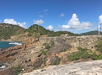 Antigua coastline, outer fort wall and guard house roof as seen from the Fort Berkeley Peninsula in...