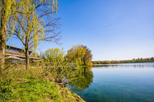 Beautiful, blue and deserted Unisee - a lake in Bremen at sun and blue sky