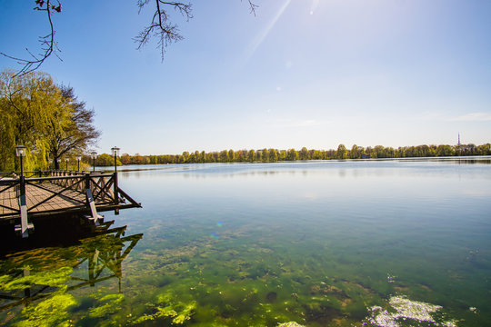 Beautiful, blue and deserted Unisee - a lake in Bremen at sun and blue sky