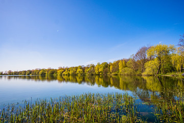 Beautiful, blue and deserted Unisee - a lake in Bremen at sun and blue sky