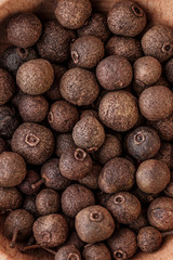Peppercorn background. Dry black pepper seeds. Top view. Flat design. Macro spice background