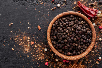 A set of peppers.Collage of different type pepper, Black ,white, pink and allspice peppercornsr,...