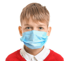 Pupil in protective mask on white background. Concept of epidemic