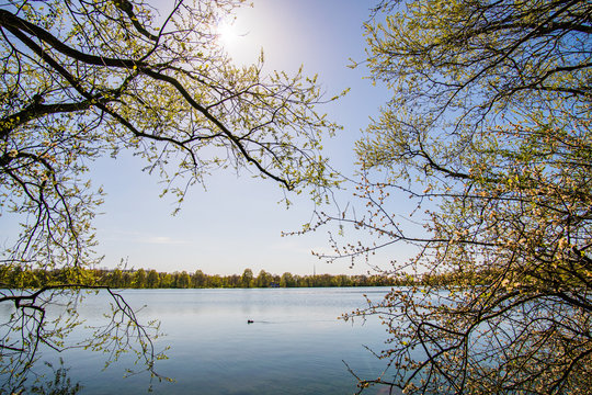 Beautiful, blue and deserted Unisee - a lake in Bremen at sun and blue sky