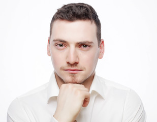 young business man thinking, over white background.