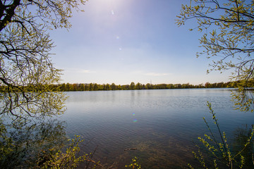 Beautiful, blue and deserted Unisee - a lake in Bremen at sun and blue sky