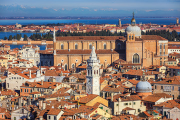 Fototapeta na wymiar Venice panoramic aerial view with red roofs, Veneto, Italy. Aerial view with dense medieval red roofs of Venice, Italy