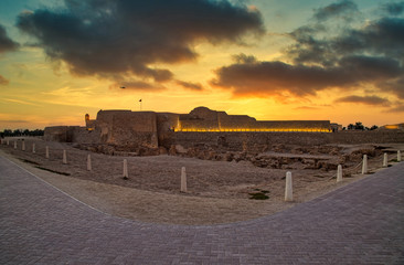 Beautiful view of Bahrain Fort at dusk with dramatic sky