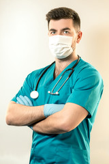young male doctor in a mask from viruses. Vertical frame