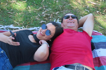happy young couple relaxing in the park