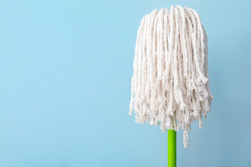 Floor mop on color background