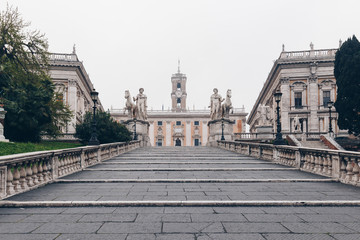 Fototapeta na wymiar Cordonata staircase and white statues of Castor and Pollux in Piazza del Campidoglio (Capitoline Square) on the Capitoline Hill, Rome, Italy