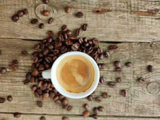 Cup and grain of coffee