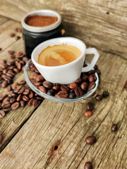 Cup and grain of coffee