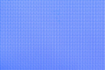 light blue plastic background with a repeating square texture.